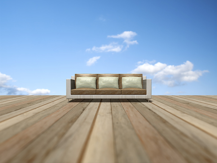 Sofa on wooden deck and blue sky