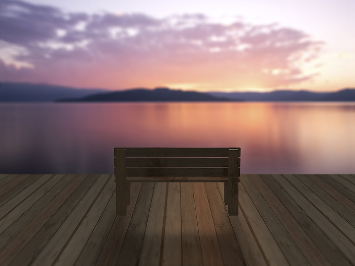 The lakeside at dusk and a bench placed