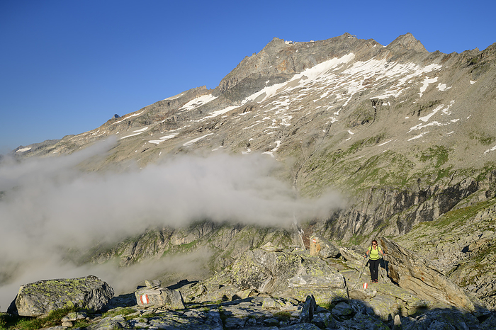 Austria, Tyrol, Female hiker following trail towards Hoher Riffler