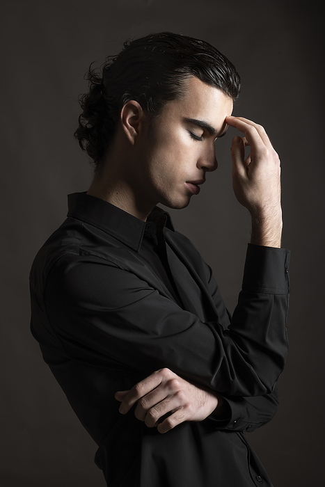 Stressed young man wearing black shirt