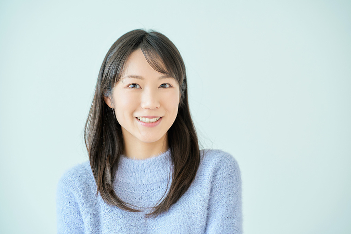 Smiling young Japanese woman with white background (People)