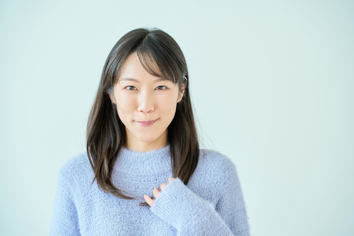 Smiling young Japanese woman with white background (People)