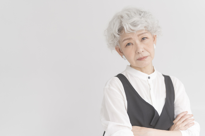 Senior Japanese woman with distressed gray hair (People)
