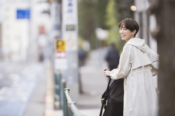Japanese woman pushing a stroller (People)