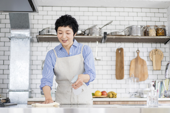 A person wiping down the kitchen (Female / Japanese)