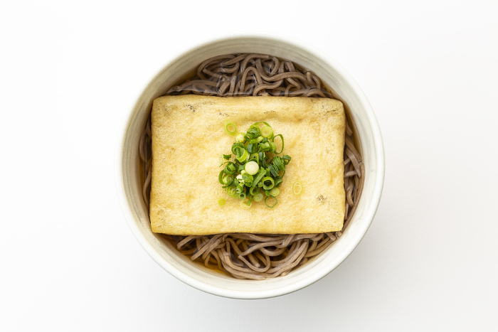 Kitsune soba (buckwheat noodle) on white background