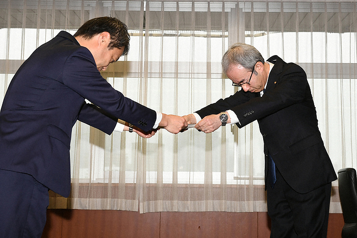 Koichi Ito, president of the company, receives a corrective action order from Hirohisa Tsuruta, director general of the Logistics and Motor Vehicles Bureau of the Ministry of Land, Infrastructure, Transport and Tourism. Koichi Ito, president of Toyota Industries Corporation, receives a corrective action order from Hirohisa Tsuruta, director general of the Logistics and Motor Vehicles Bureau of the Ministry of Land, Infrastructure, Transport and Tourism  left , regarding the engine certification fraud issue by Toyota Industries Corporation.