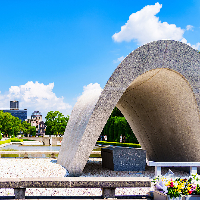 Cenotaph for the A-bomb Victims in Peace Park with the A-bomb Dome in the background.