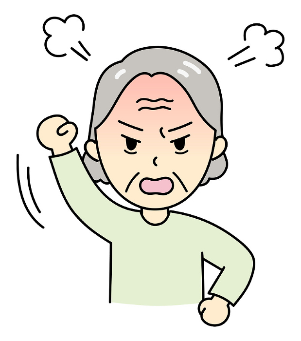 An angry old lady with her fists in the air.