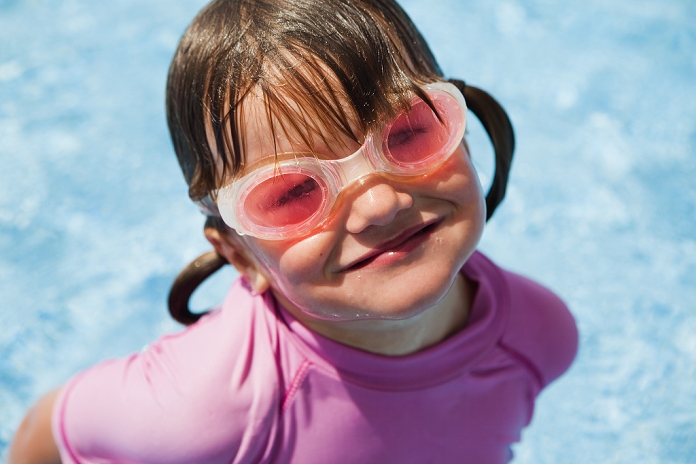 Girl at the swimming pool wearing goggles; tarifa, cadiz, andalusia, spain