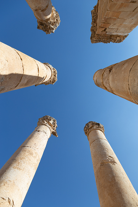 Blue sky and roman columns viewed from right under, Jerash, Jordan, Jerash Governorate, Jerash, by Cavan Images / Marco Rof