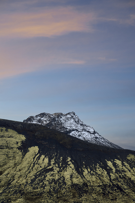 Mountain ridge under sky at sunset, Kópavogur, Iceland, by Cavan Images / Oscar Bjarnason