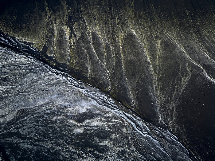 Amazing landscape of volcanic terrain with braided rivers, Selfoss, Iceland, by Cavan Images / Oscar Bjarnason