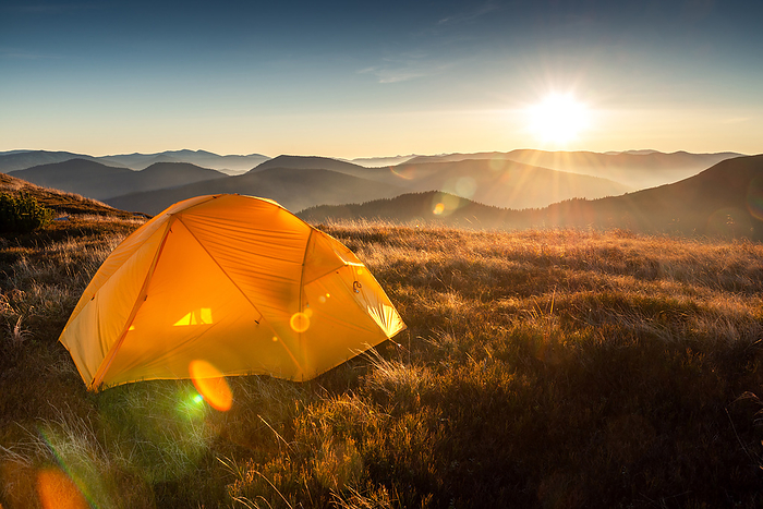Campsite With a Yellow Tent In The Mountains, First Morning Light, Nehrovets', Zakarpattia Oblast, Ukraine, by Cavan Images / Artur Abramiv