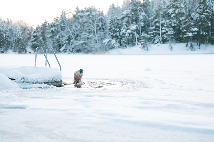 woman taking a cold water swim in the baltic sea in Sweden, Stockholm, Stockholm County, Sweden, by Cavan Images / Rachel Bell