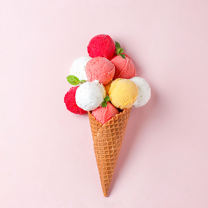 vibrant various ice cream balls scoops stacked in a waffle cone, California City, California, United States, by Cavan Images / Galigrafiya