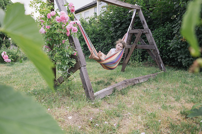 two teenage  play in the summer garden near the house. Country life., Mainz, Rhineland-Palatinate, Germany, by Cavan Images / Alena Kinderfotografin