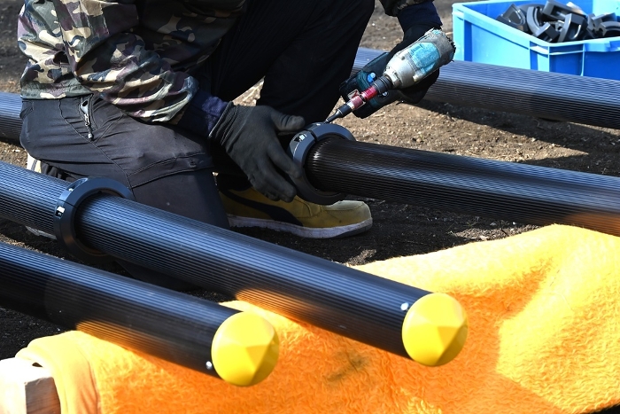 Scene of installation of playground equipment in a children's playground