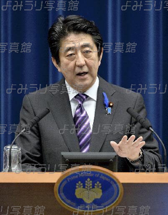 Prime Minister Abe: New government position on the limited exercise of the right of collective self defense. Prime Minister Abe at a press conference. On the evening of January 1, the government held an extraordinary cabinet meeting at the Prime Minister s Office and decided on a new government position that allows the limited exercise of the right of collective self defense, which had been considered impossible under the interpretation of the Constitution. At a press conference, Prime Minister Shinzo Abe affirmed that Japan will never again become a nation at war, and stressed that this will lead to improved deterrence in light of the tense situation in East Asia, including the rise of China. The new government view marks a major turning point in Japan s postwar security policy. At the Prime Minister s Office, photographed at 6:04 p.m. on July 1, 2014. The same month, on July 2, the morning edition of the same newspaper  Limited Acceptance of the Right of Collective Self Defense: Shift in Security Policy, New Interpretation of the Constitution, Cabinet Decision  was published.