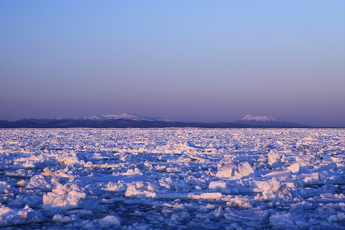 Kunashiri Island with drift ice and evening view from Notsuke Peninsula, Hokkaido