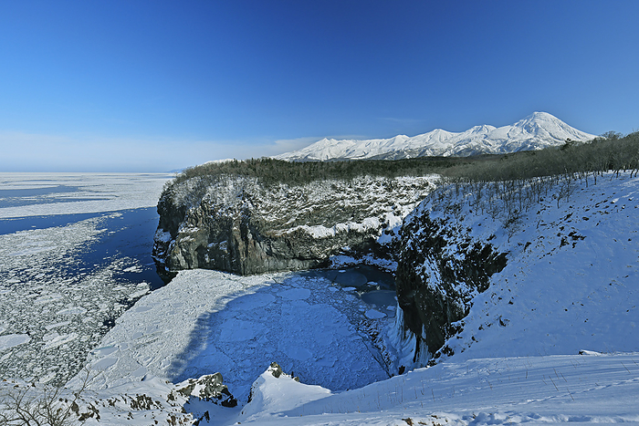 Hokkaido Yunohana Falls, drift ice and the Shiretoko mountain range