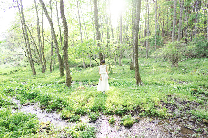 Beauty portrait of a young Japanese woman in a lush natural setting (People)