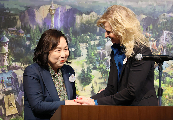 Tokyo Disney Resort announce overview of the new area  Fantasy Springs  February 27, 2024, Urayasu, Japan   Tokyo Disney Resort operator Oriental Land chairwoman and CEO Yumiko Takano  L  shakes hands with Disney Parks International president Jill Estorino  R  as they announce overview of the DisneySea s new area  Fantasy Springs  in Urayasu, suburban Tokyo on Tuesday, February 27, 2024, 100 days before of the opening of the new facilities. The Fantasy Springs has three attractions of Frozen Kingdom, Rapunzel s Forest, Peter Pan s Never Land and a luxury hotel Fantasy Springs Hotel.     photo by Yoshio Tsunoda AFLO 