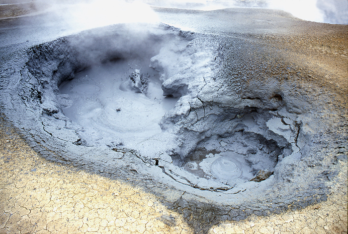 Volcanic mud spring, Namaskard, Iceland Sulphurous mud, steam and gas emanating from the subsurface of Namaskard, an area in the mid north of Iceland. They are an unmistakeable indication of the geothermal activity present in the subsurface., by DIRK WIERSMA SCIENCE PHOTO LIBRARY