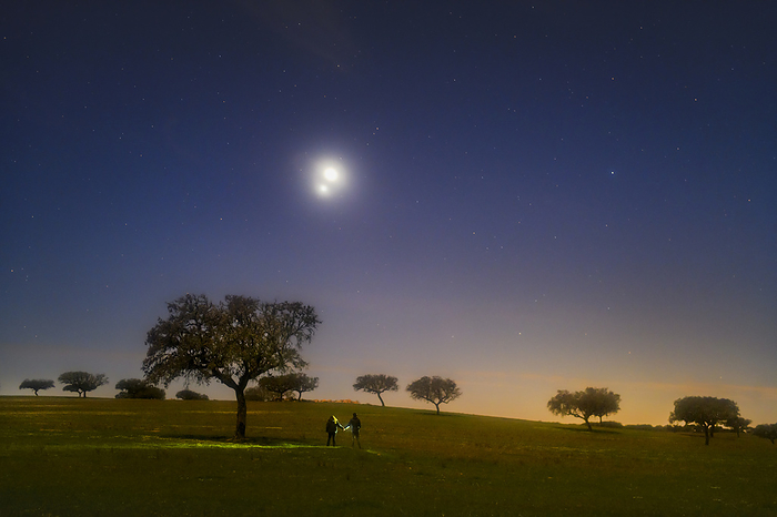 Venus and Jupiter in conjunction, 2023 Moonlit scene showing Venus and Jupiter in conjunction at centre left. This was the closest that the two planets will come for viewers from Earth until 2039. Image taken in the Dark Sky Alqueva territory in Portugal., by MIGUEL CLARO SCIENCE PHOTO LIBRARY