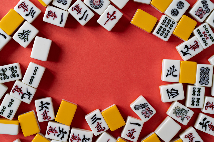 Mahjong tiles on red background