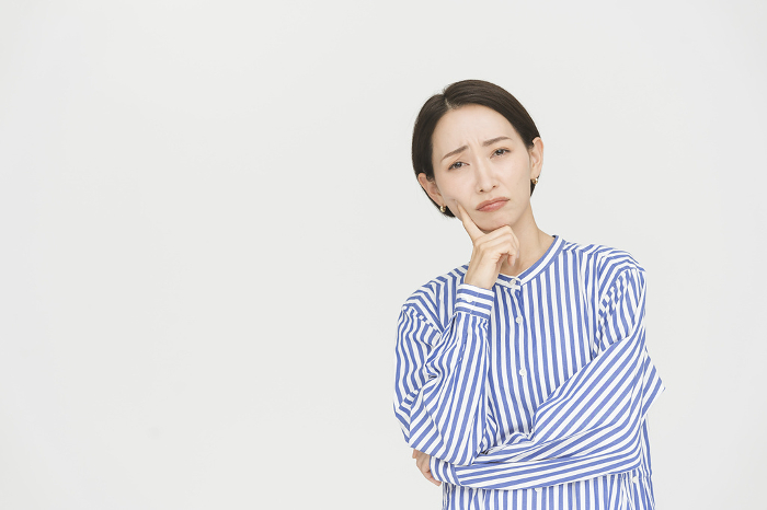 Healthy middle generation Japanese woman / Studio shot white background (People)