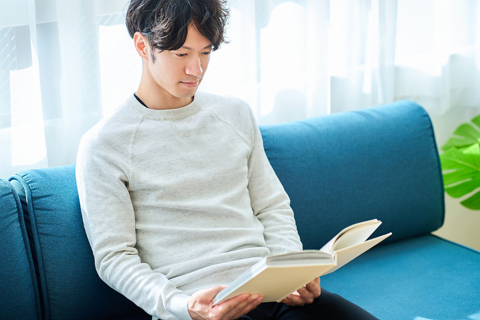 Young Japanese man reading a book (People)
