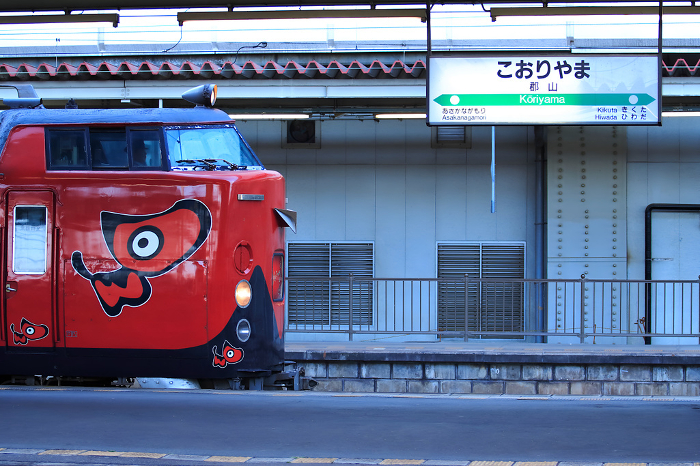 Aizu express painted with red bezel departing from Koriyama Station
