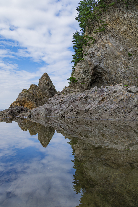 Landscape of the coast reflected in a water mirror near Senkokuiwa Tunnel, Fukaura-machi, Nishitsugaru-gun, Aomori, Japan