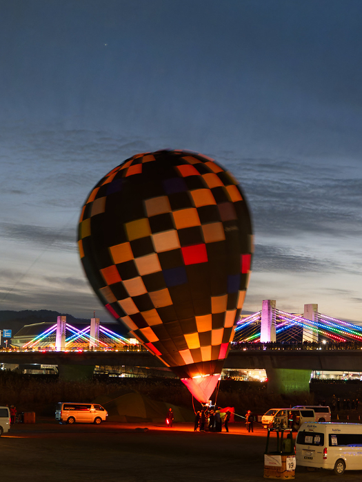 Hot air balloons lit at night at the Kameoka Balloon Fiesta