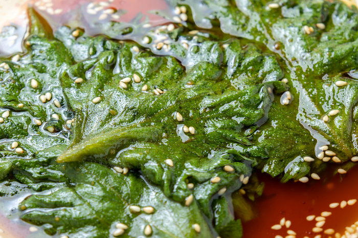 Close-up of shiso leaves in soy sauce (with sesame).