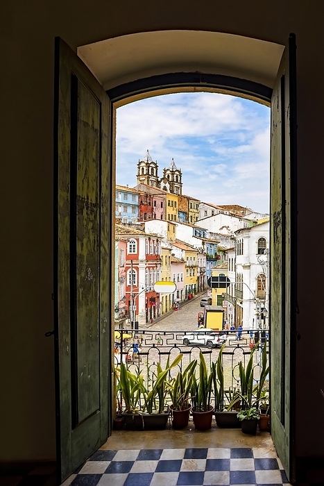 Open door in an old colonial house overlooking the Pelourinho neighborhood and its hillsides in Salvador, Bahia, Brasil, by Fred Pinheiro