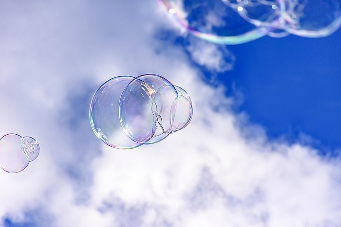 Soap bubbles with their colors and transparencies floating in the blue sky, Belo Horizonte, Minas Gerais, Brasil, by Fred Pinheiro