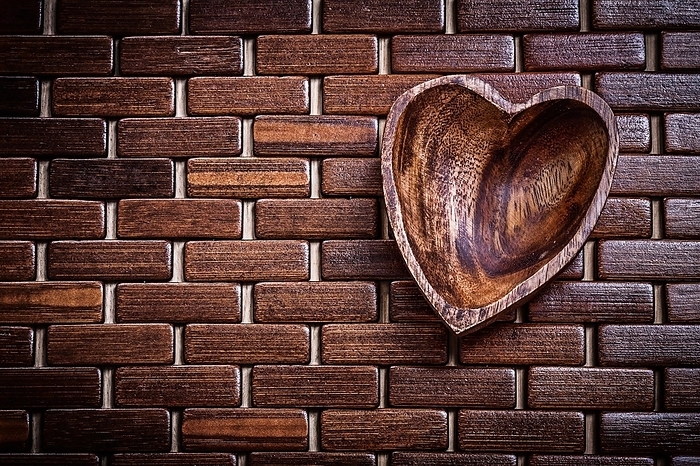 Heartshaped bowl on wooden matting food and drink concept, by Dzmitri Mikhaltsow