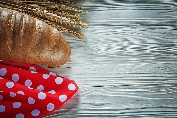 Bread stick rye ears red tablecloth on white board, by Dzmitri Mikhaltsow