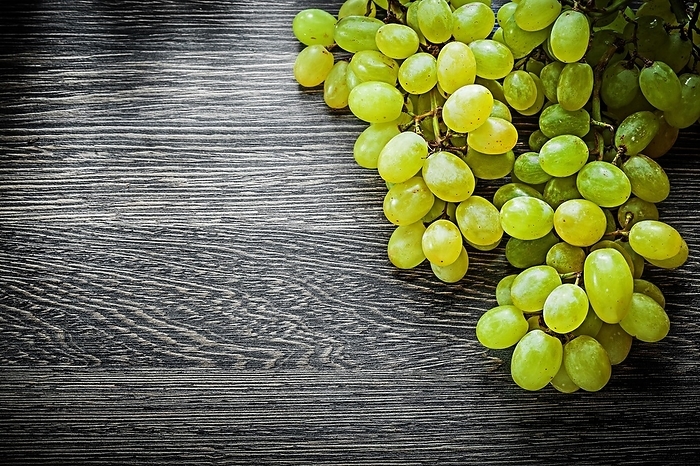 Sweet grapes on wooden board food concept, by Dzmitri Mikhaltsow
