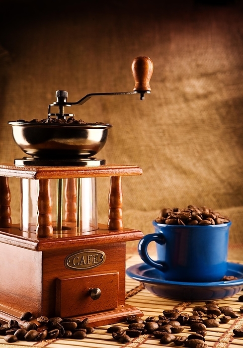 Compositioon of grinder and coffee grains and blue mug, by Dzmitri Mikhaltsow