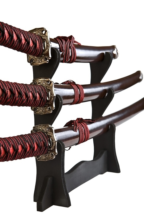 Samurai swords on a wood stand, by Dzmitri Mikhaltsow