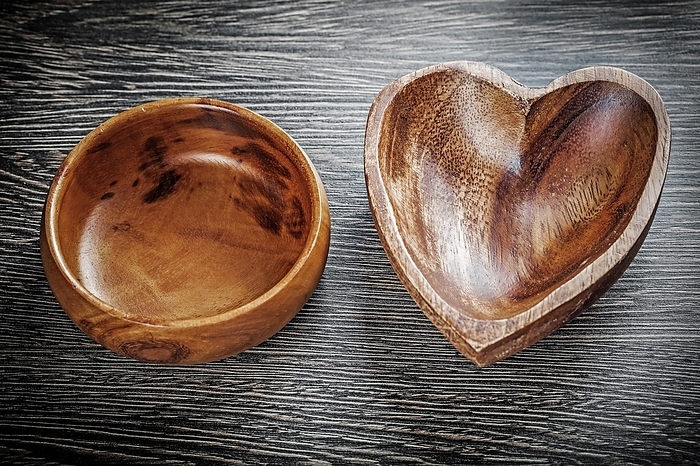 Set of empty wooden bowls on wood board, by Dzmitri Mikhaltsow