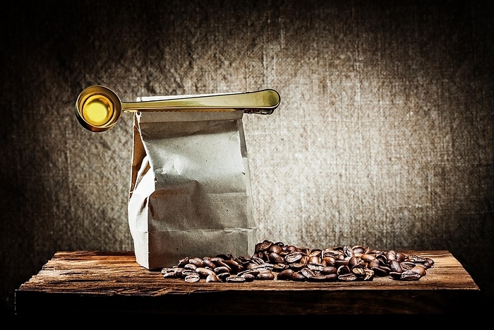Paper bag with coffee beans ang spoon, by Dzmitri Mikhaltsow