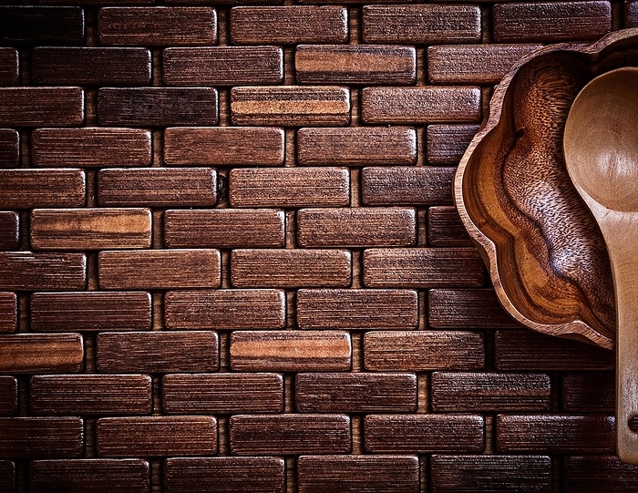 Flowershaped wooden bowl and spoon on wood matting copy space, by Dzmitri Mikhaltsow