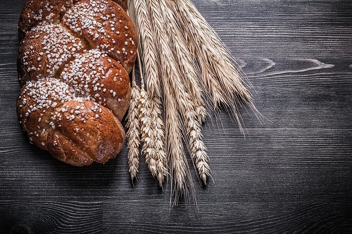Bread wheat and rye ears on wooden board, by Dzmitri Mikhaltsow
