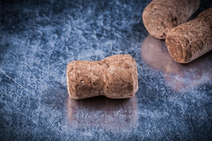 Champagne cork taps on scratched background food and drink concept, by Dzmitri Mikhaltsow
