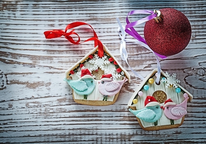 Christmas bauble gingerbread biscuits on a vintage wooden board, by Dzmitri Mikhaltsow
