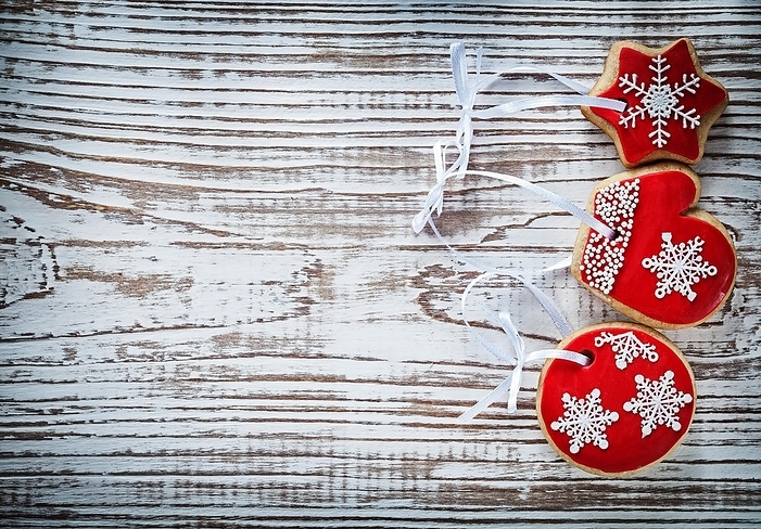Composition of Christmas gingerbread cookies on vintage wooden board, by Dzmitri Mikhaltsow
